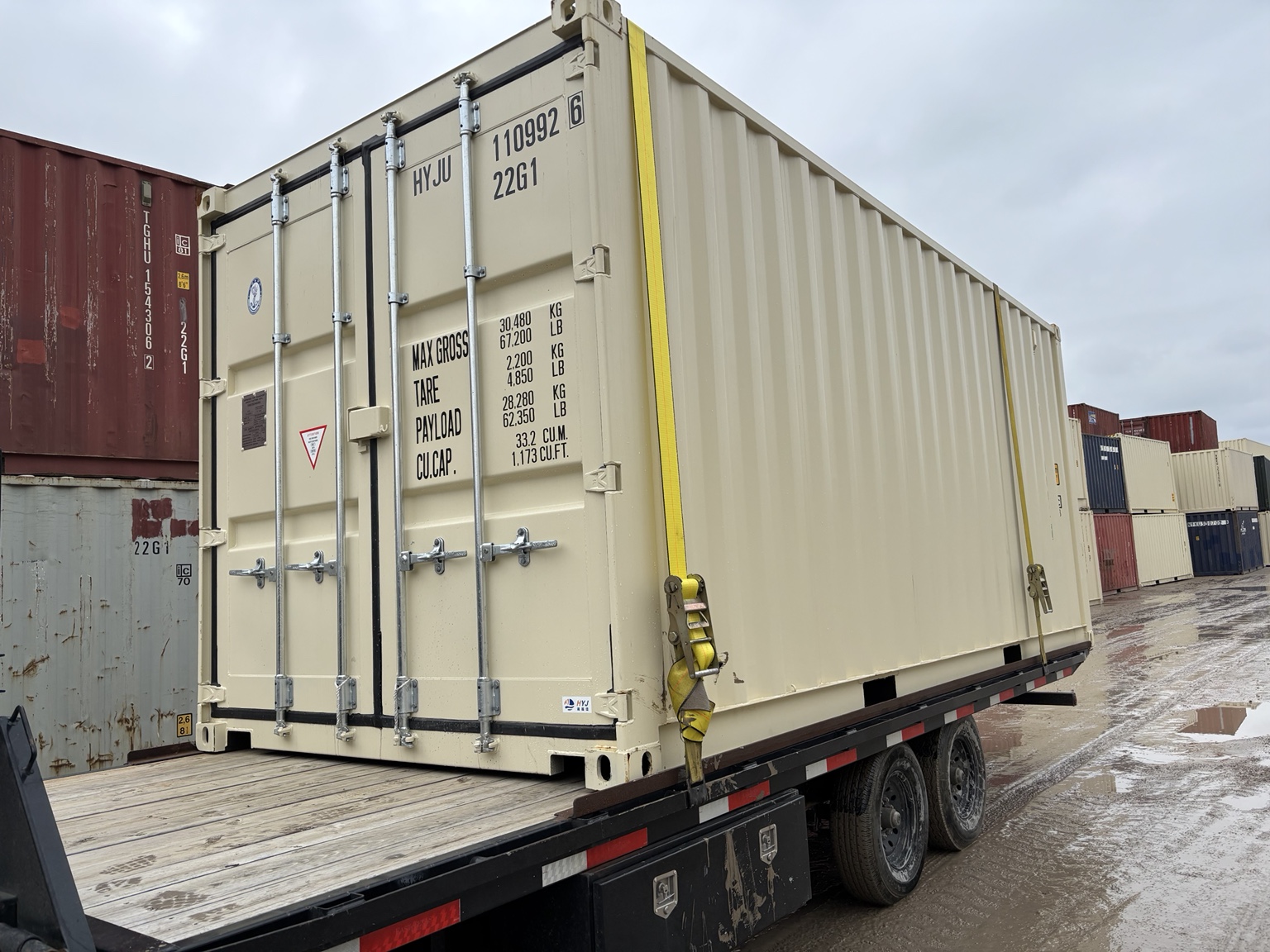 New shipping container loaded on trailer